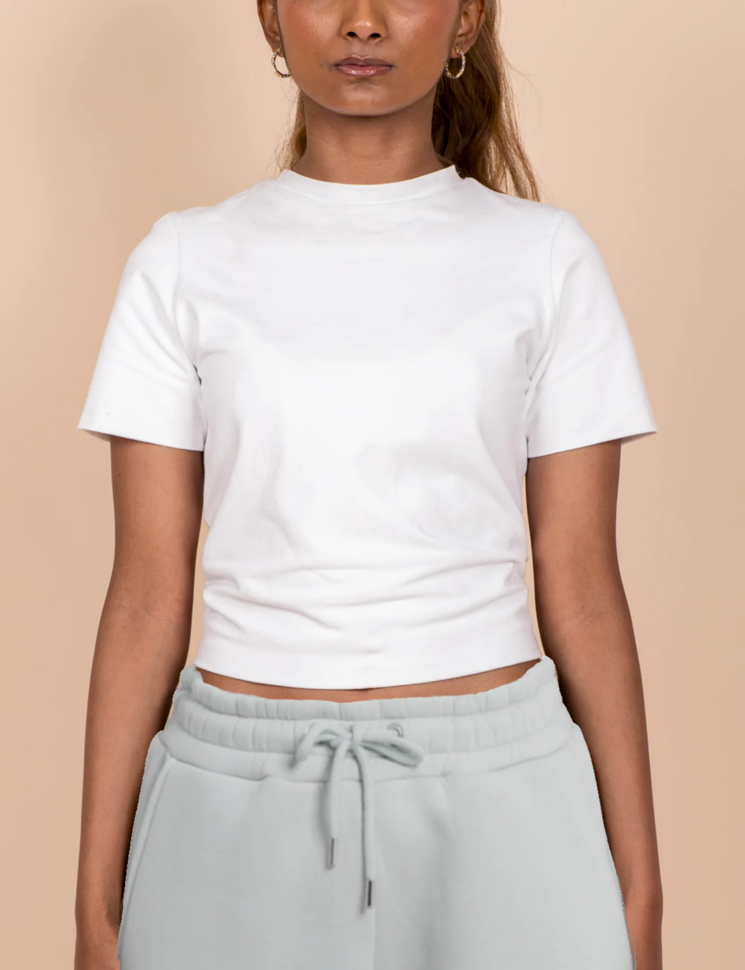 Woman wears white t shirt